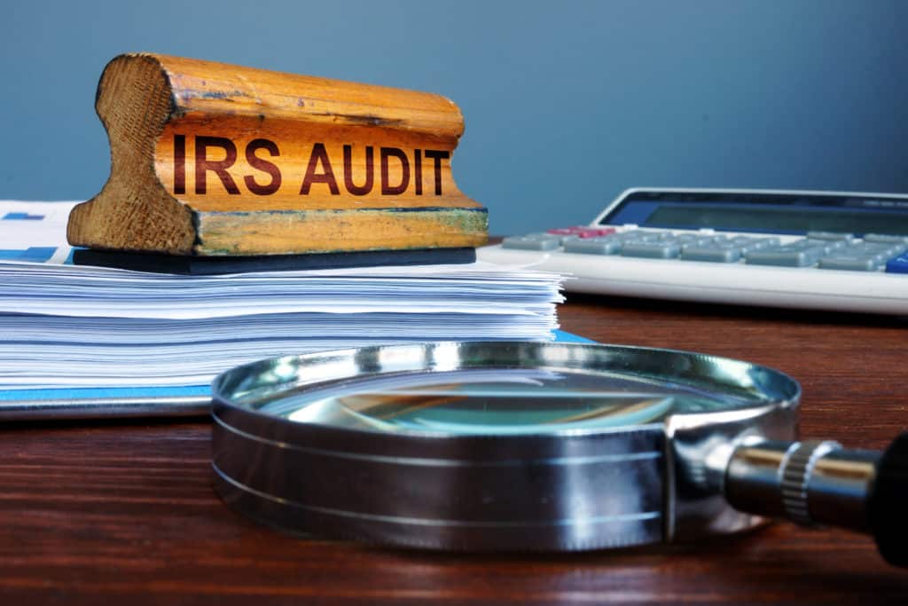 IRS audit stamp and accounting documents for a cannabis business